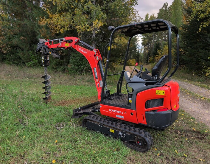 Our Kubota mini excavator equipped with an auger